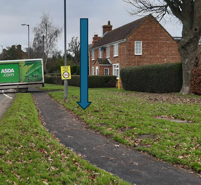 East Entrance to village pole